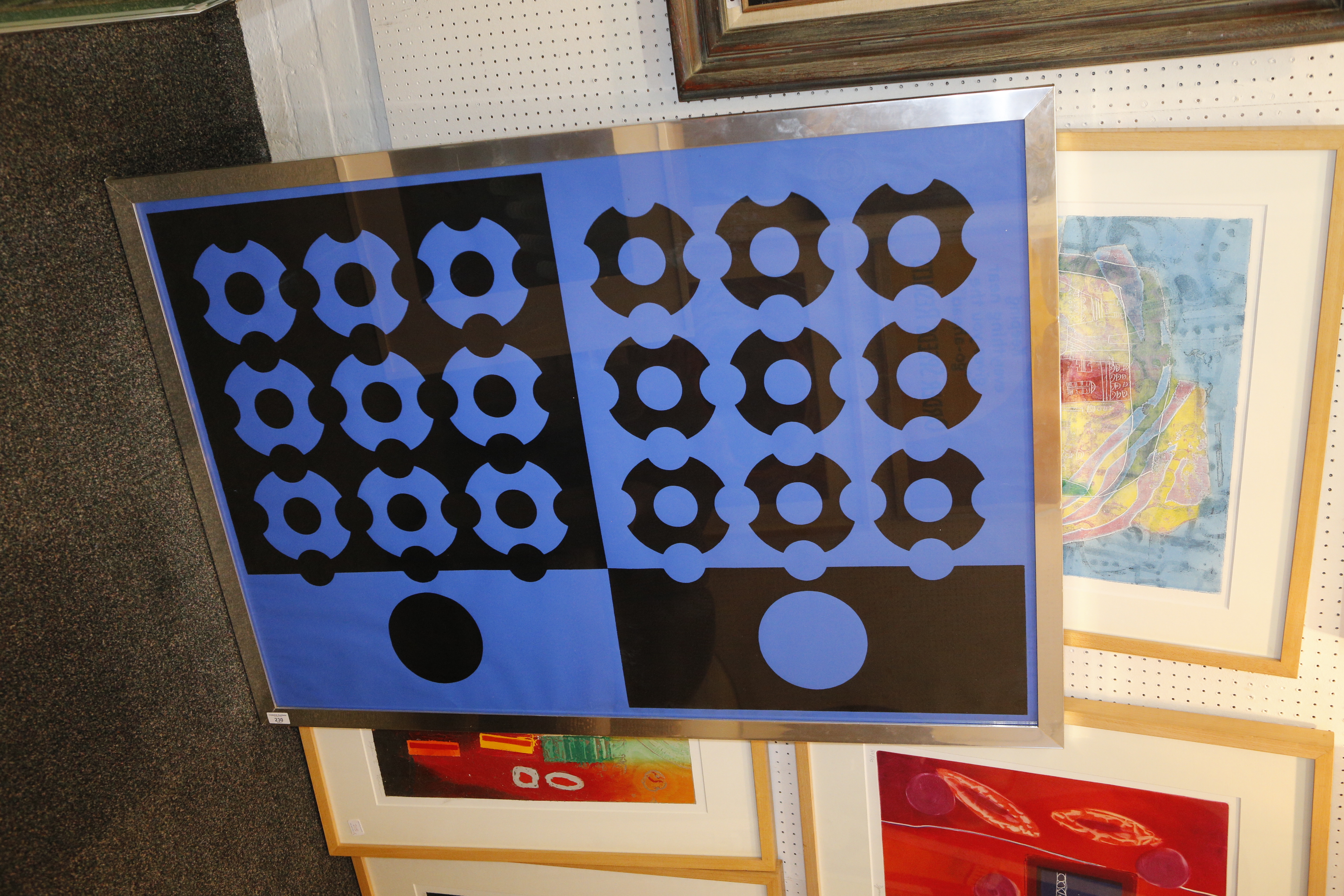 A 1970`s op art print, blue and black geometric pattern.