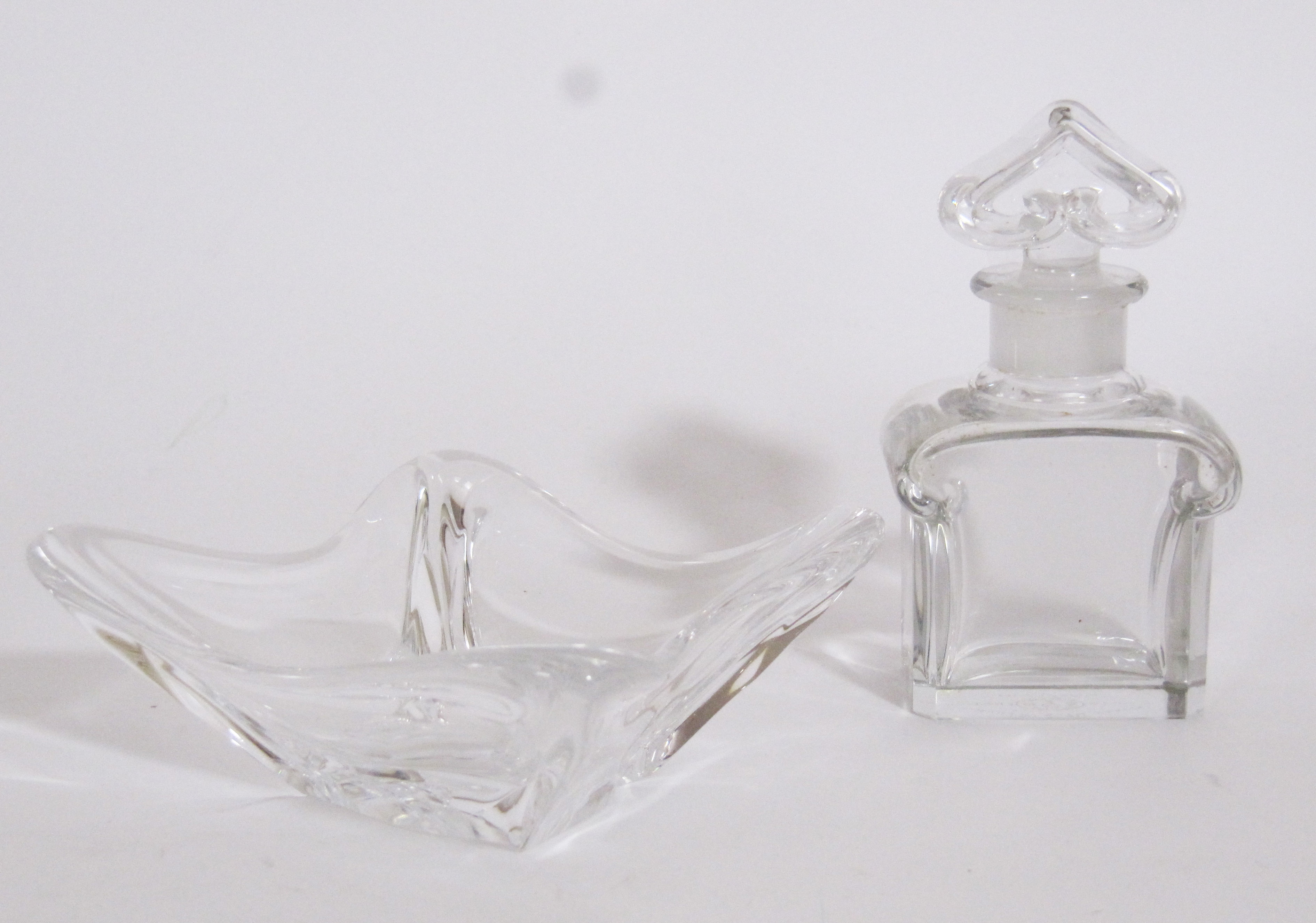 A Baccarat crystal glass `Guerlain` perfume bottle, circa 1950, the inverted heart shaped stopper