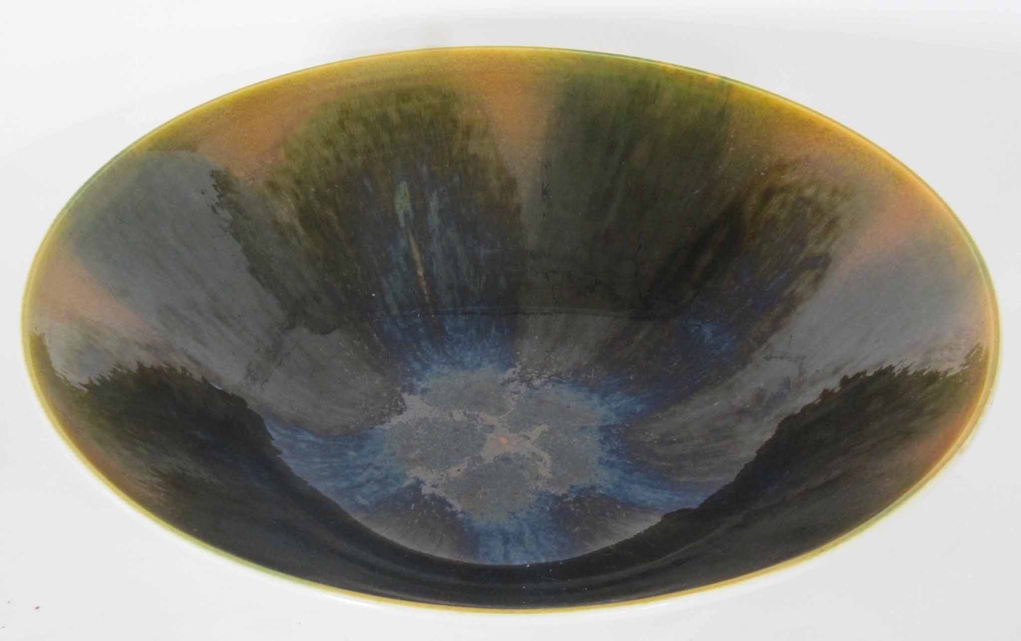 A Poole Studio bowl, circa 1970`s, a white ceramic bowl internally decorated with blue iridescent