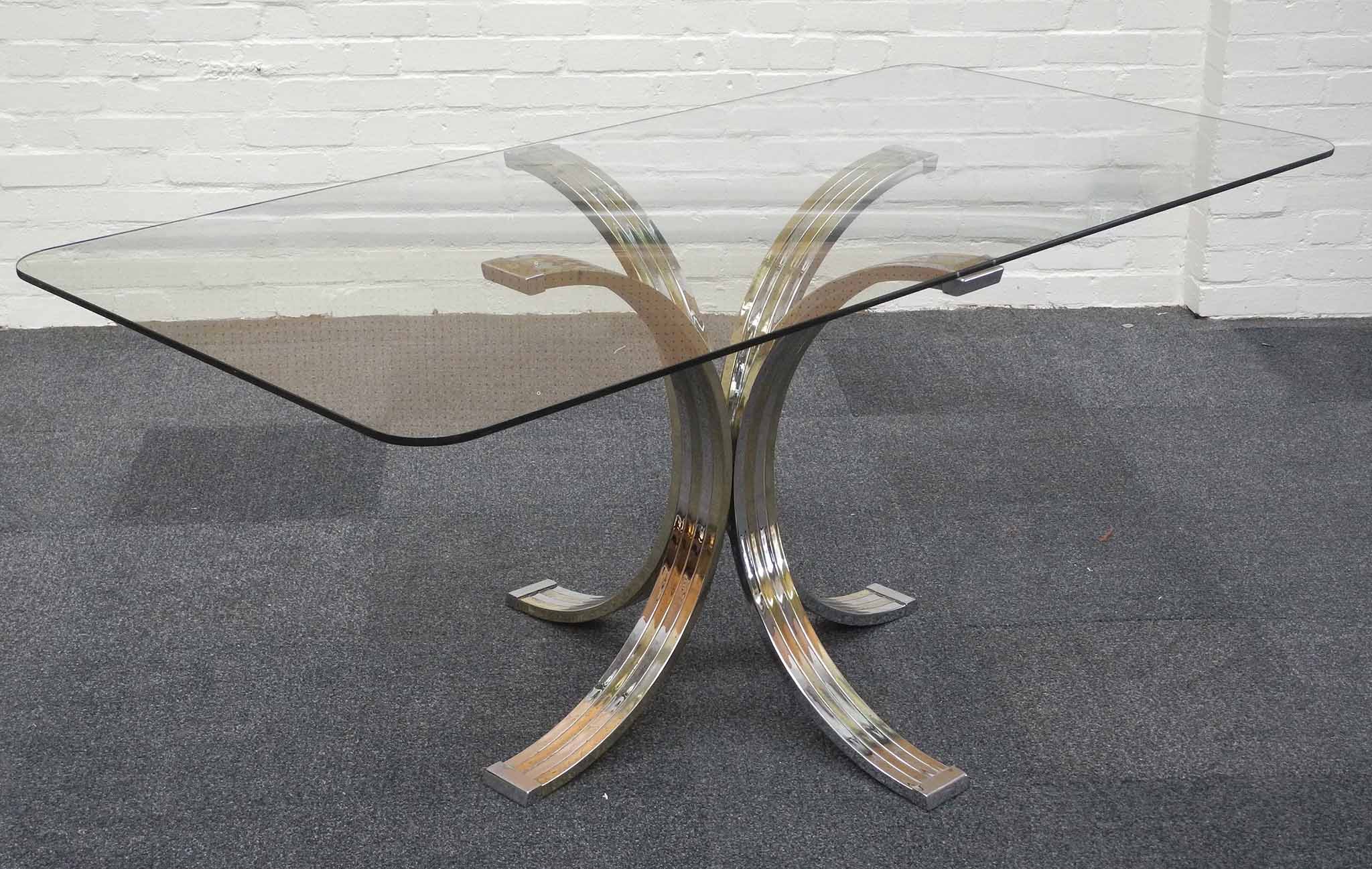 An Italian 1970`s dining table, attributed to Banci, a rectangular glass top on chrome and gilt