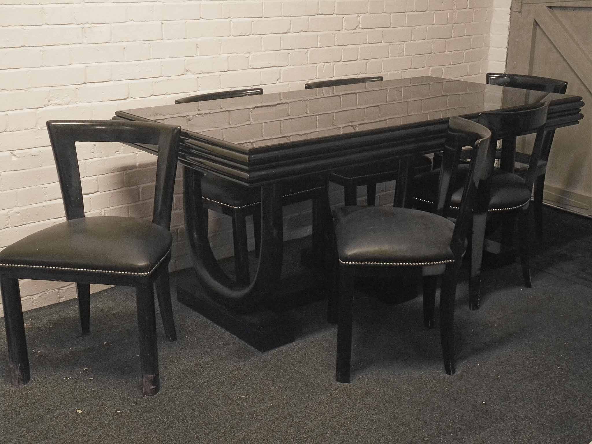 An Italian Art Deco ebonised dining suite, circa 1940, consisting of six Gugliielmo Ulrich dining