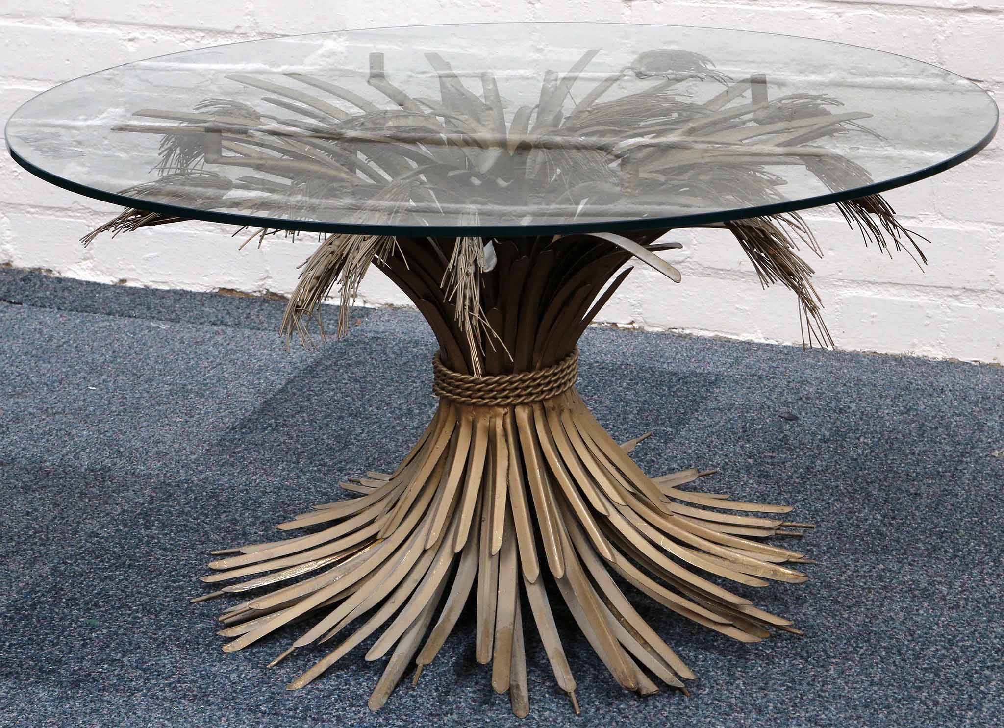 An Italian Wheat Sheaf coffee table, circa 1950, round glass top on gilt metal base. 82cm dia x 46cm