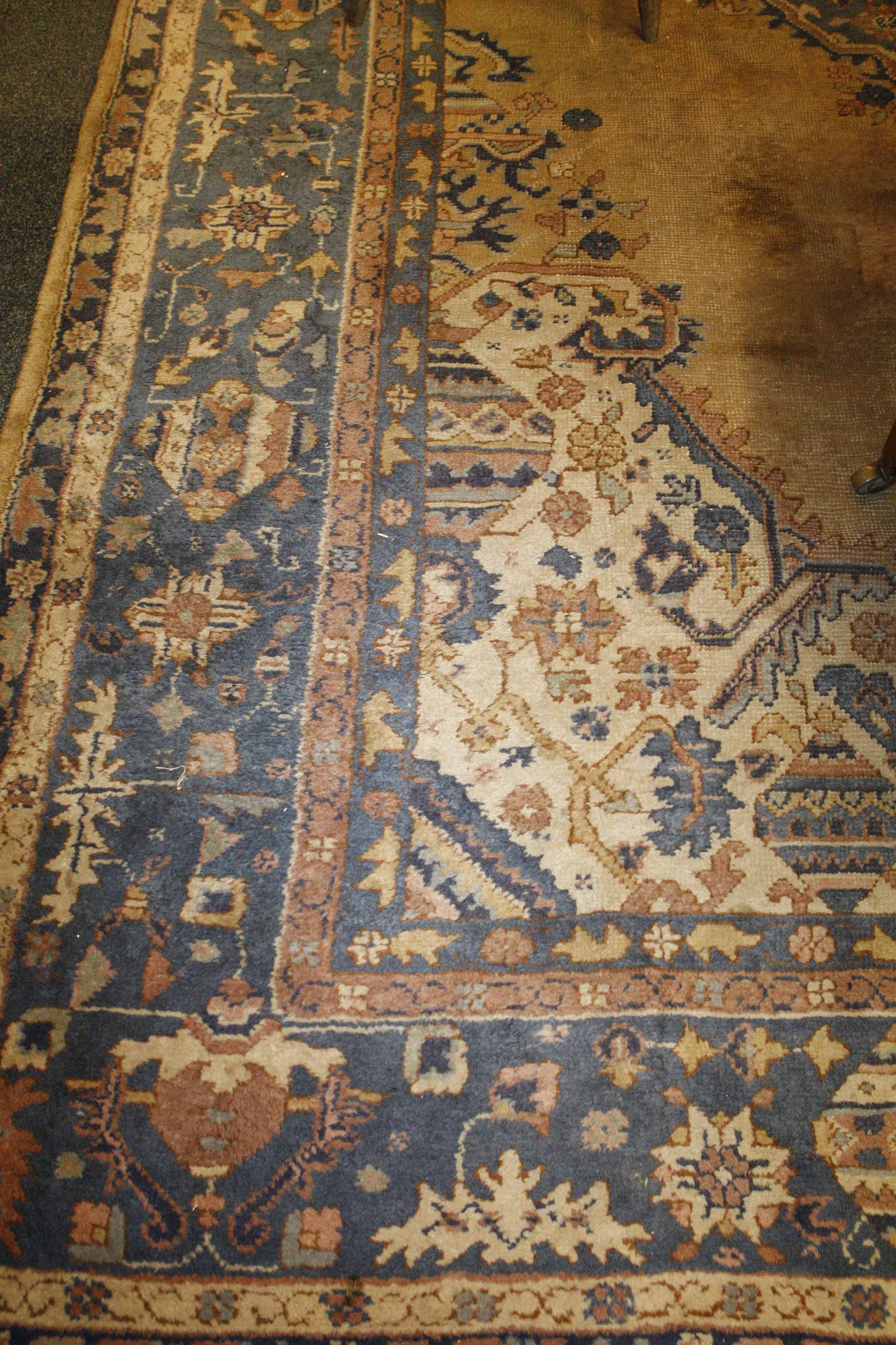 An antique Oushak carpet. 3 x 4m