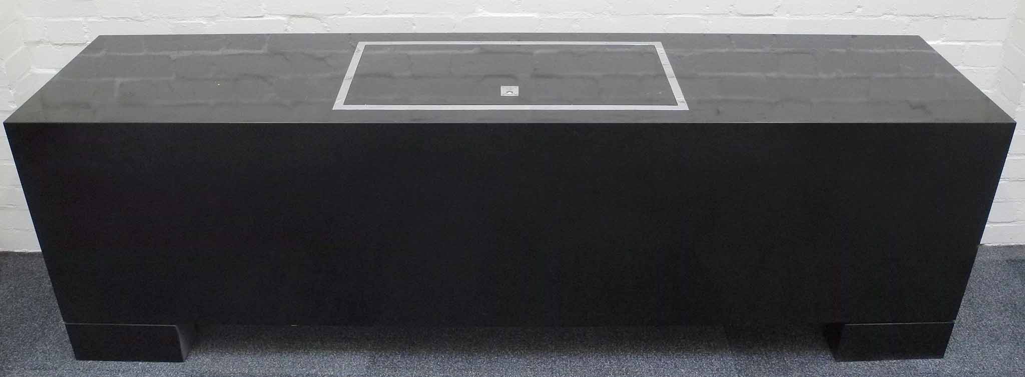 A Mario Sabot sideboard, circa 1970, black lacquer surfaces with chrome border and handle on