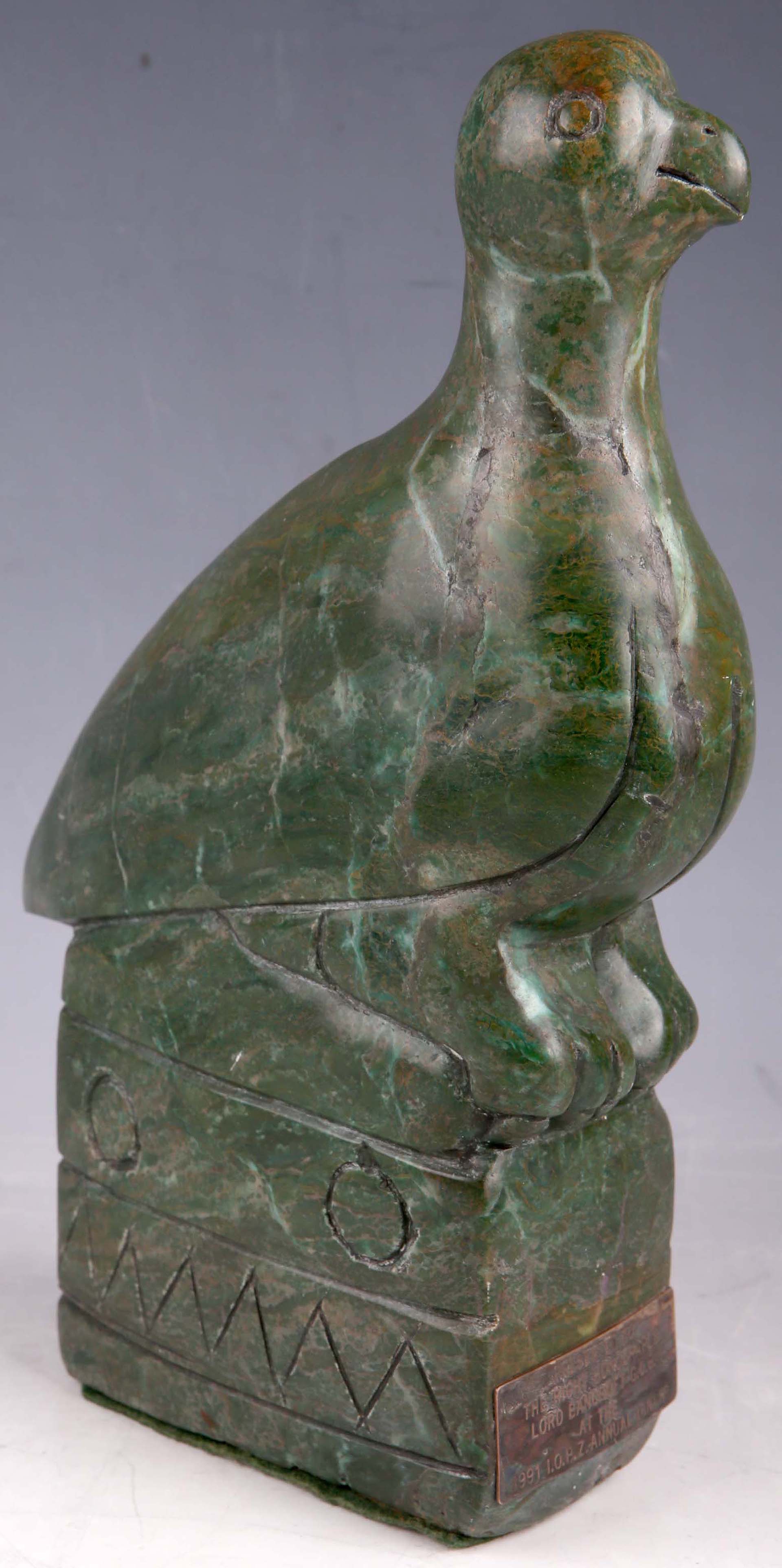 A South American dark green variegated stone sculpture of bird, bears presentation plaque for Lord