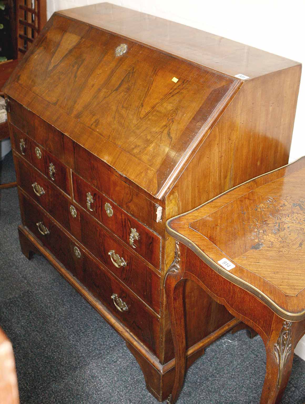 A Georgian walnut bureau, with fall front concealing fitted interior over two short over two long