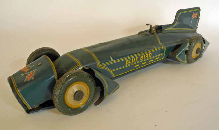 A 1933 `Bluebird` tin plate clockwork model car by Gutermann, circa 1950. 51cm Provenance: