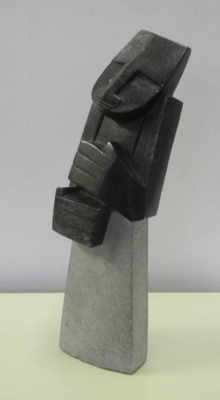 A modern Shona stone sculpture from Zimbabwe, Africa, cubic figural subject, signed: John Chewa.