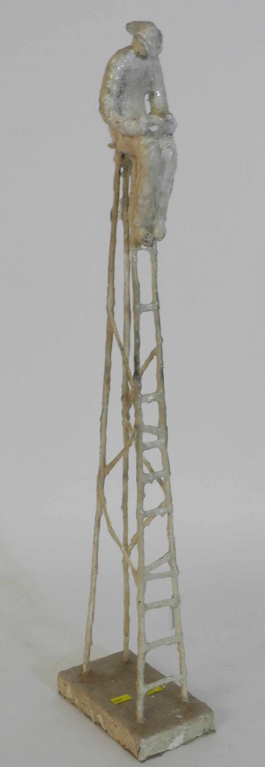 A Cuban sculpture in the style of Giacometti, modelled as a man seated on a very tall stool.