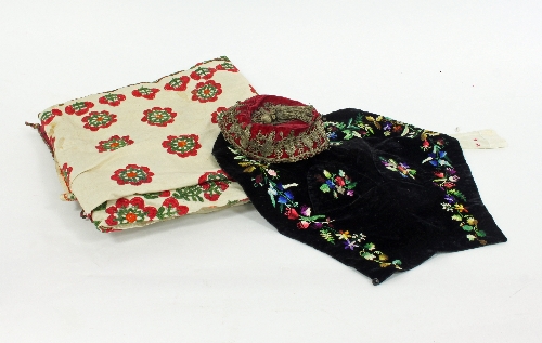 An Uzbekistan cover, a Tyrolean apron front, a small twin saddle bag and a fez with thread