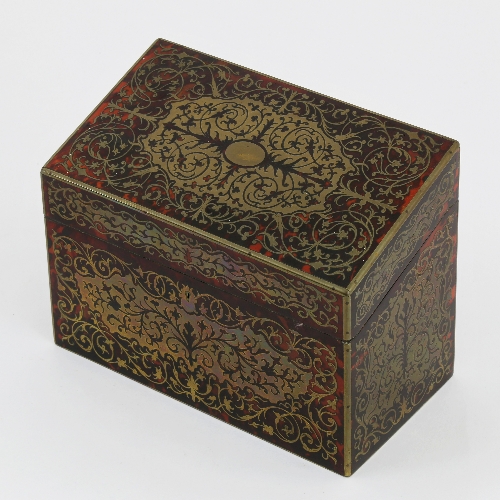 A tortoiseshell and brass inlaid stationery box, by Asprey, the sloping hinged lid enclosing a