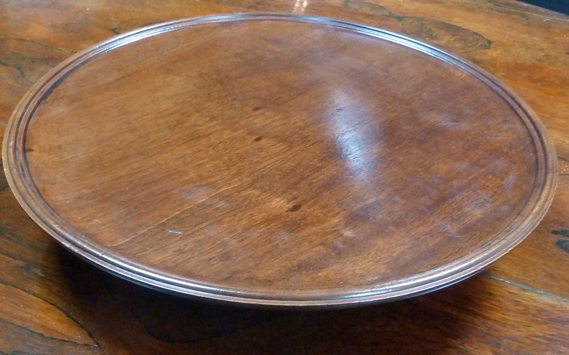 A mahogany lazy Susan, 40.5cm (16") diameter    Condition Report:  top and bottom in two sections,