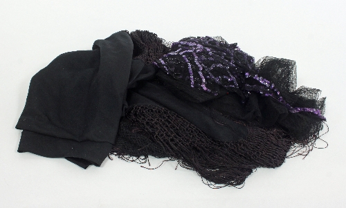 A black shawl with crocheted and fringed border, a black veil with sequined border and a pair of