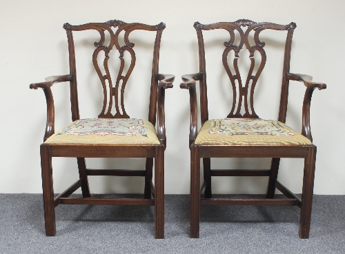 A pair of George III style mahogany armchairs with pierced splat backs and drop-in seats