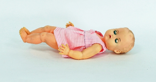 A Rosebud doll, with sleepy eyes and jointed limbs
