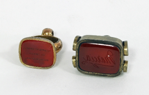 A 19th Century seal fob, the cornelian matrix engraved 'To Love is Union, to Trust Communion', and