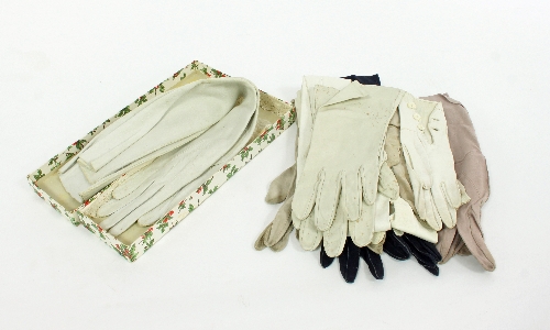 A pair of kid gloves in orginal box and sundry pairs of kid and other gloves