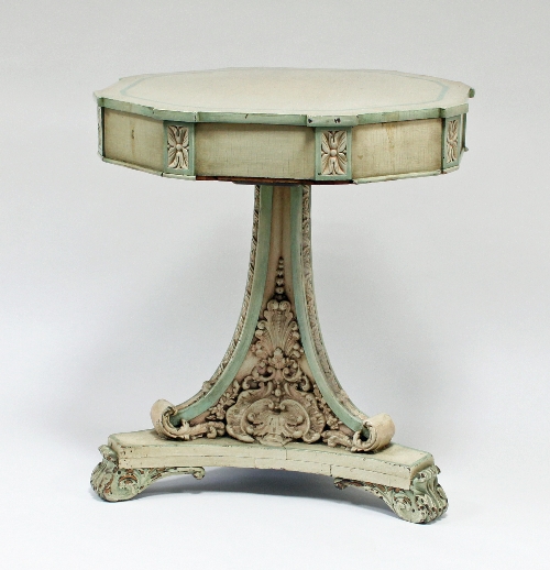 A Victorian painted octagonal topped drum table, with frieze drawers on scroll and plaster moulded