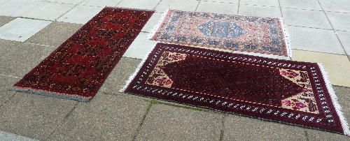A Hamadan style rug with four central star medallions, 205cm x 79cm (80.5" x 31"), another rug