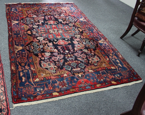 A Hamadan rug with central blue ground geometric field and border, 254cm x 153cm (100" x 60.25") and - Image 3 of 4