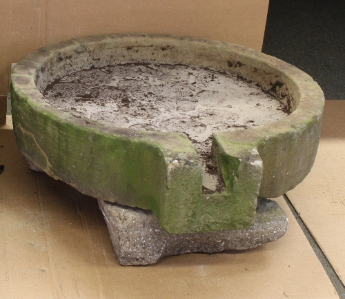 A circular sandstone cider press stone with spout, 61cm (24") diameter