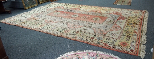 A large Turkish carpet, of geometric design within a multiple border, 460cm x 307.5cm (181" x 121")