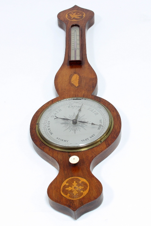 A mahogany banjo-shaped barometer and thermometer, the case inlaid shell, star and bird patera