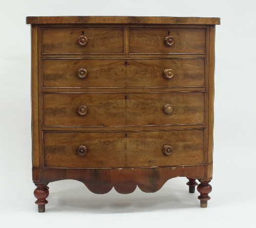 A Victorian mahogany bowfront chest of two short drawers over three long drawers on turned legs,