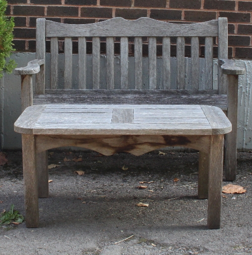 A slatted garden seat, 130cm (51") wide and a matching table, 100cm (39") wide