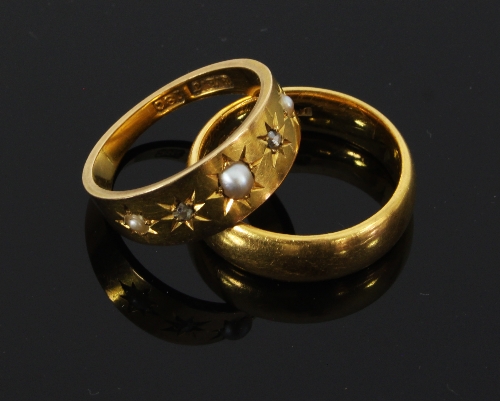 A Victorian 18ct gold half pearl and diamond ring, gypsy set with three half pearls and two rose cut