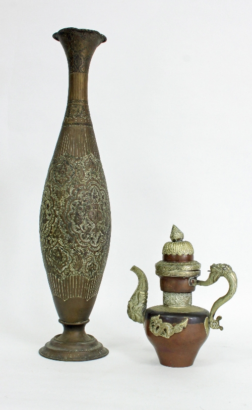 A Middle Eastern copper and brass coffee pot with applied dragon decoration, 26.5cm (10.5") high and