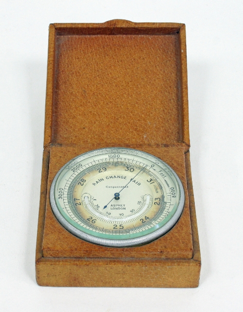 An Asprey compensated barometer, the silvered dial with scale from 23-31, in a leather case