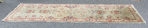 A circular Chinese rug of pink ground, 173cm (68") diameter and a lime green ground runner, 259cm - Image 2 of 2