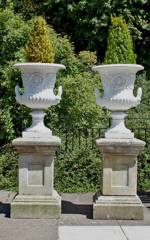 A pair of cast iron two-handled campana vases, painted white, with acorn, oak leaf and acanthus