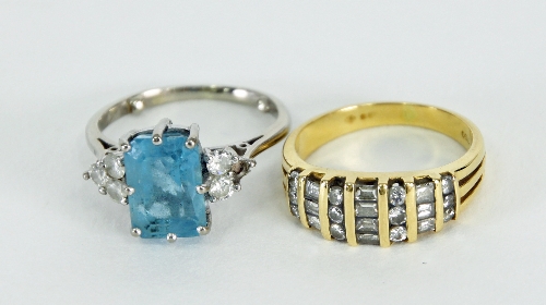 A diamond set dress ring in 18ct gold, ring size J ½ and a gem set dress ring