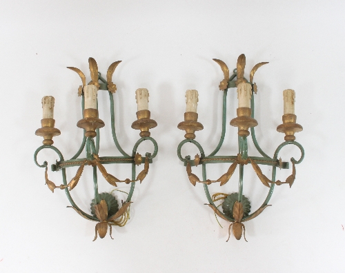 A pair of green and gilt painted three-branch wall lights, the branches suspending swags, 48cm (19")