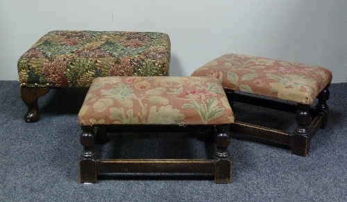 An upholstered footstool on  dwarf cabriole legs, 40cm (15.5") wide and two smaller footstools