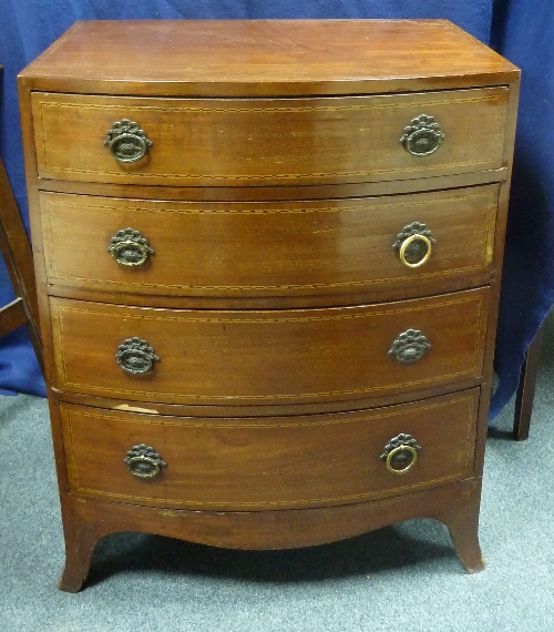 A Edwardian bowfront chest of four graduated drawers on splay feet, 61cm (24") wide