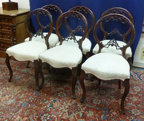 Six Victorian mahogany chairs with pierced oval backs