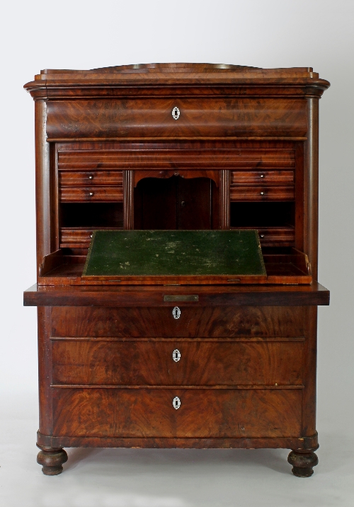 A Biedermeier escritoire, the fall front enclosing a fitted interior with one long drawer above