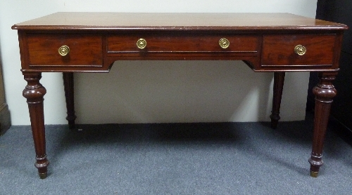 A William IV mahogany table, fitted three frieze drawers, on turned fluted legs, 135cm (53”) wide