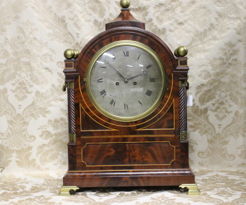 A finest quality English Regency flame mahogany bracket clock having silvered dial and striking