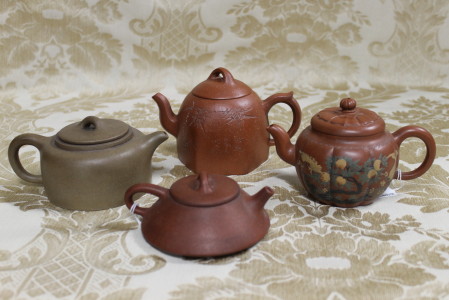 Four good Chinese terracotta tea pots, signed. Height 8cm, Width 15cm
