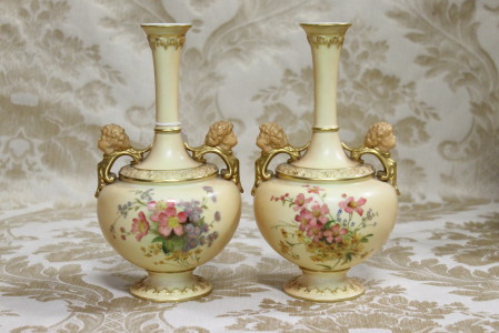 A superb quality pair of English Royal Worcester two handled vases having mask head and floral