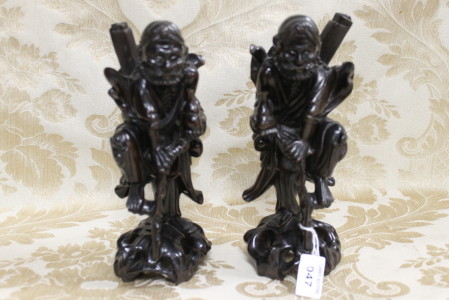 A finely carved pair of cherry wood Chinese figures depicting immortals. Height 21cm, Width 8cm