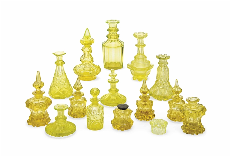 A GROUP OF BOHEMIAN URANIUM AND YELLOW GLASS
LATE 19TH CENTURY
Comprising cut and moulded scent-