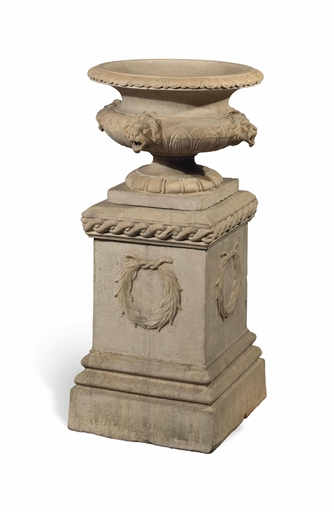 A VICTORIAN TERRACOTTA WATER FOUNTAIN URN
PROBABLY GARNKIRK, LATE 19TH CENTURY
Modelled with four