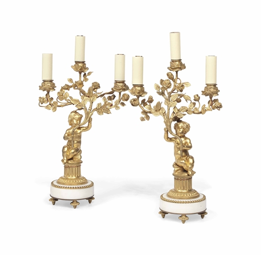 A PAIR OF FRENCH GILT-BRONZE THREE LIGHT CANDELABRA
OF LOUIS XV STYLE, LATE 19TH / EARLY 20TH