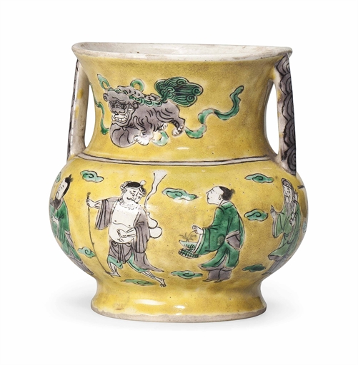 A CHINESE YELLOW-GROUND FAMILLE VERTE BISCUIT JAR
KANGXI PERIOD (1662-1722)
With twin handles,