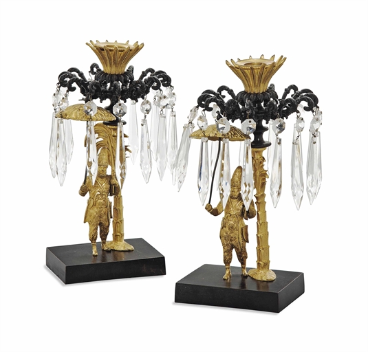 A PAIR OF LOUIS PHILIPPE GILT AND PATINATED BRONZE CANDLESTICKS
CIRCA 1840 AND LATER
Each figure